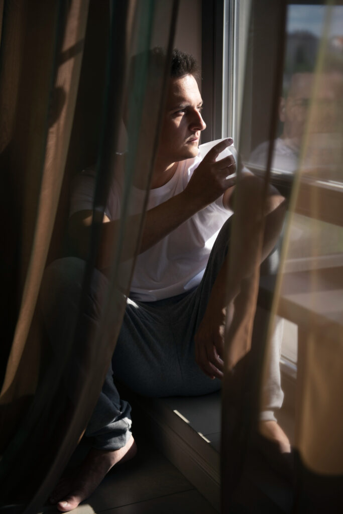 man thinking outside before session with anxiety therapist